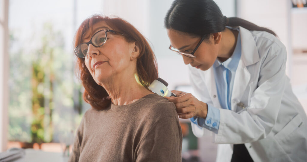 A doctor doing a Skin Cancer Check on a patient